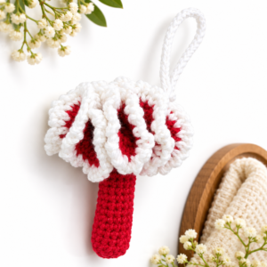 red and white crochet spa scrubber